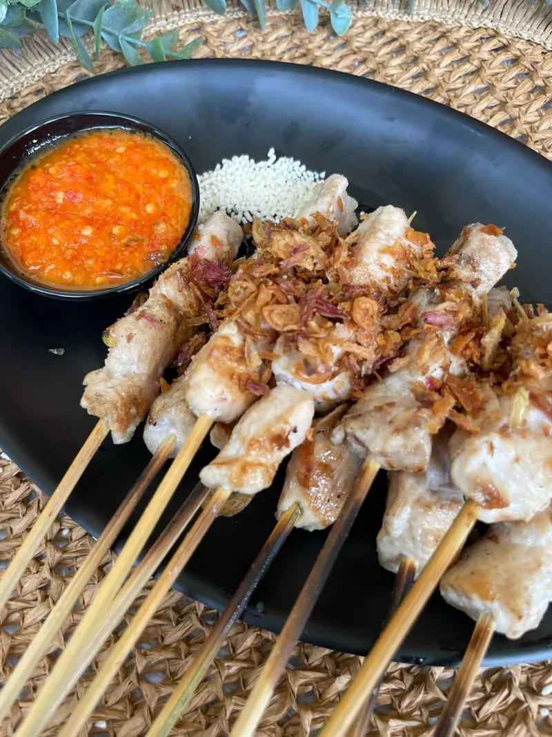 Taichan Dada dengan sambal khas dan taburan bawang goreng